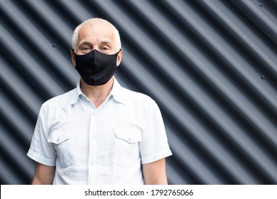 Senior man wearing a protective medical mask, place for text, copyspace - Powered by Shutterstock