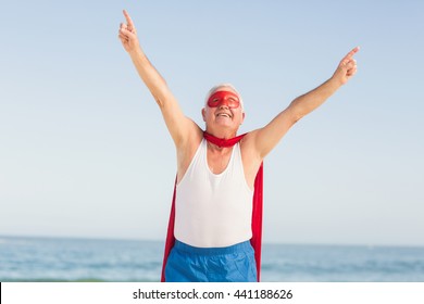 Senior Man Wearing Superman Costume On A Sunny Day