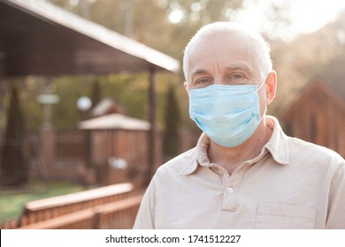 Senior man wears protective mask against infectious diseases and flu, health care concept. coronavirus quarantine. - Powered by Shutterstock