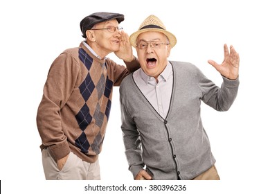 Senior man whispering something to his friend and laughing together isolated on white background