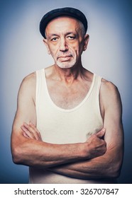 Senior Man In A White Singlet And Cap