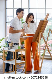 Senior Man And Woman Couple, Husband And Wife, Painting Image Together In Home Gallery With Warm And Happy Circumstance. Idea For Time-sharing And Relaxing For Older People After Retirement.