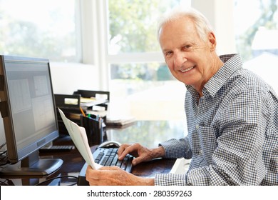 Senior Man Working On Computer At Home