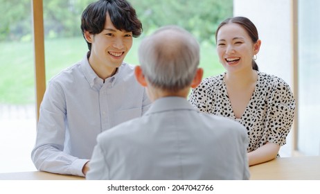 Senior man and young man and woman talking - Powered by Shutterstock