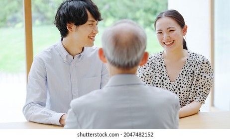 Senior man and young man and woman talking - Powered by Shutterstock