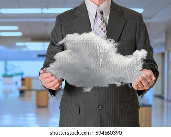 Senior manager holding cloud computing