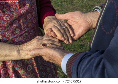 Senior Married Couple Holding Hands - Getting Old Together, Equality Concept