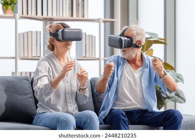 Senior mature couple sitting on the sofa having fun with virtual reality glasses, Happy elderly technology concepts
 - Powered by Shutterstock