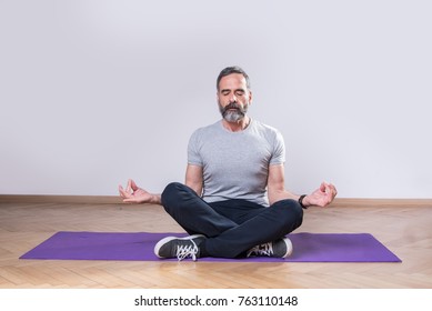 Senior mature man practicing yoga