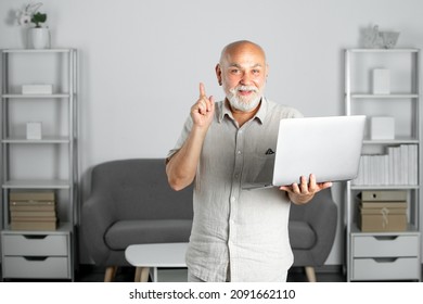 Senior Mature Older Man Watching Business Training, Online Webinar On Laptop Computer, Remote Working. Aged Businessman On Video Conference Calling In Virtual Chat.