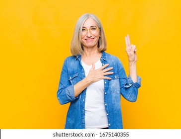 Senior Or Middle Age Pretty Woman Looking Happy, Confident And Trustworthy, Smiling And Showing Victory Sign, With A Positive Attitude