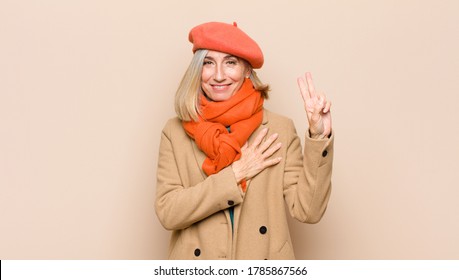 Senior Or Middle Age Pretty Woman Looking Happy, Confident And Trustworthy, Smiling And Showing Victory Sign, With A Positive Attitude