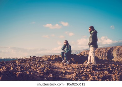 Senior Mother And 45 Year Old Son Spend Good Time Together Hiking And Observing The Beauty That Surrounds Them