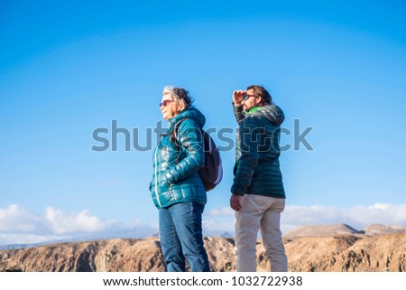 Similar – Image, Stock Photo Young couple taking a walk near the coast