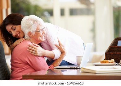 Senior Mother Being Comforted By Adult Daughter