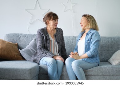 Senior Mother At Home And Adult Child Smile. Daughter In Law Mother In Law. Portrait Of Elderly Mother And Middle Aged Daughter Smiling Together