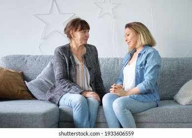 Senior Mother At Home And Adult Child Smile. Daughter In Law Mother In Law. Portrait Of Elderly Mother And Middle Aged Daughter Smiling Together