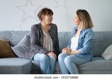 Senior Mother At Home And Adult Child Smile. Daughter In Law Mother In Law. Portrait Of Elderly Mother And Middle Aged Daughter Smiling Together