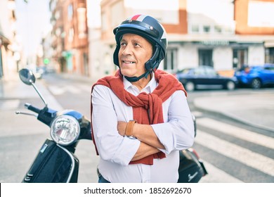 Senior Motorcyclist Man Smiling Happy Wearing Moto Helmet At The City.