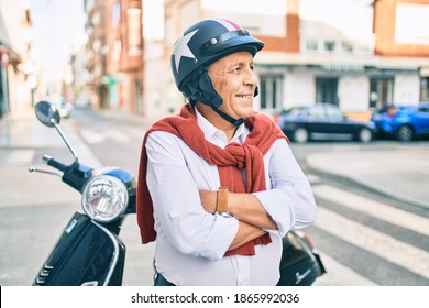 Senior Motorcyclist Man Smiling Happy Wearing Moto Helmet At The City.