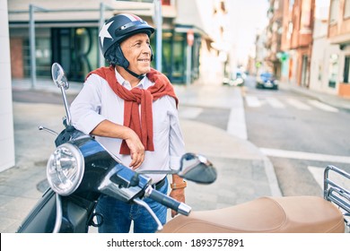 Senior Motorcyclist Man Smiling Happy Wearing Moto Helmet At The City.