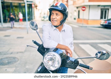 Senior Motorcyclist Man Smiling Happy Wearing Moto Helmet At The City.