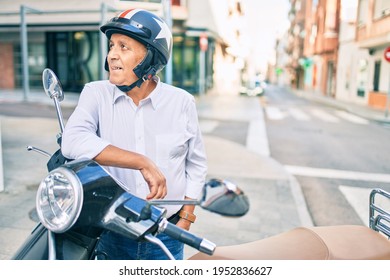 Senior Motorcyclist Man Smiling Happy Wearing Moto Helmet At The City.