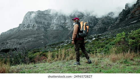 Senior, mountain or black man hiking in nature adventure or journey in woods or outdoor travel. View, forest and person thinking on trail walking for holiday, break or trekking to explore in France - Powered by Shutterstock