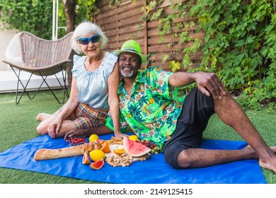 Senior multiethnic couple at pic-nic outdoors - Powered by Shutterstock