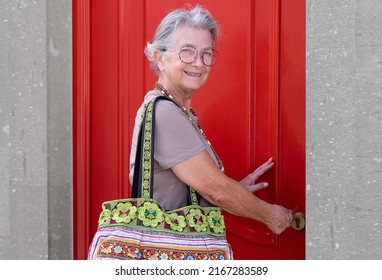 Senior Old Aged Woman Opening The New House Apartment Looking At Camera, Older Retired Caucasian Female Real Estate Owner Make Sale Purchase Property Deal Concept