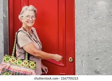 Senior Old Aged Woman Opening The New House Apartment Looking At Camera, Older Retired Caucasian Female Real Estate Owner Make Sale Purchase Property Deal Concept