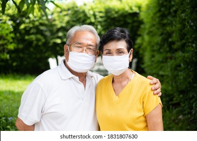 Senior Old Asian Couple, Wearing Face Mask To Protect Coronavirus Covid-19