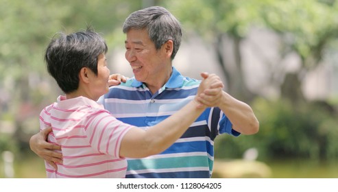 Senior Old Couple Dancing At Outdoor