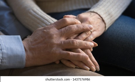 Senior old couple husband and wife holding hands close up view, mature elderly family grandparents together empathy support trust in marriage, middle aged people relationship health care concept