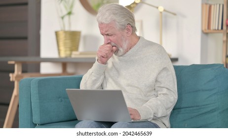 Senior Old Man With Laptop Coughing At Home