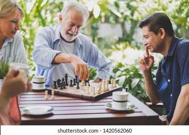 Senior old man playing chess game on chess board for strategy and planning concept - Powered by Shutterstock