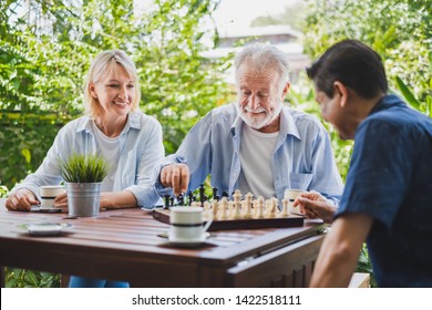 Senior old man playing chess game on chess board for strategy and planning concept - Powered by Shutterstock