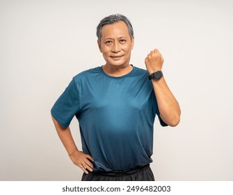 Senior old man wearing sportswear using Smart Watch Showing Heart Rate Monitor on isolated background. Technology for health and sport mode. Exercise and take statistics to develop your potential - Powered by Shutterstock