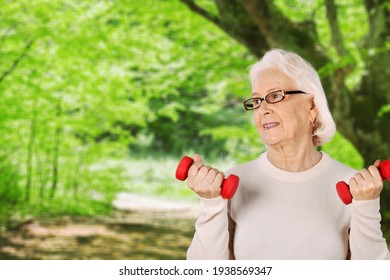 Senior Old Woman Lifting Weights And Working Out At Home.