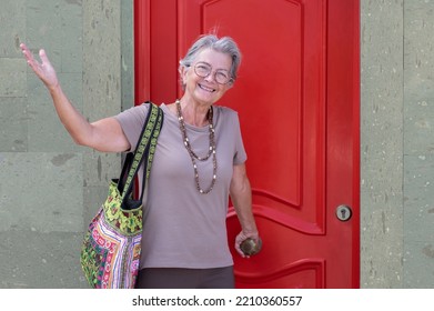 Senior Old Woman Opening The New House Apartment Looking At Camera, Older Retired Caucasian Female Real Estate Owner Make Sale Purchase Property Deal Concept