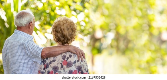 Senior Older Couple Cuddling Outdoors