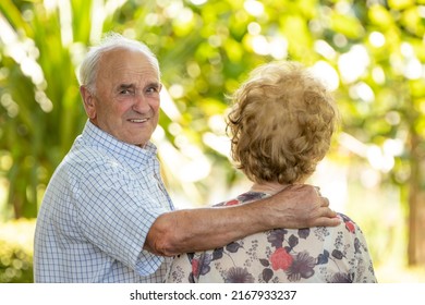 Senior Older Couple Cuddling Outdoors