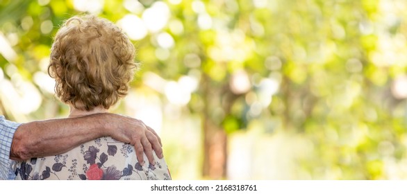 Senior Older Couple Cuddling Outdoors