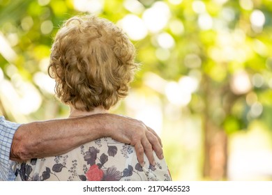 Senior Older Couple Cuddling Outdoors