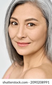 Senior Older Mid Aged Asian Woman Of 50s With Grey Hair Looking At Camera. Advertising Of Antiage Rejuvenating Procedures For Women In Menopause. Skincare, Cosmetology Ads. Closeup Portrait.