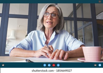 Senior Older Middle Aged Business Woman Teacher, Remote Tutor, Distance Coach Talking To Camera At Virtual Meeting Web Conference Video Call Chat Working Online. Videocall App Screen Web Cam View.