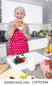  Senior Or Older Woman With Grey Hair Cooking In Kitchen - Dessert.