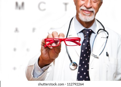 senior ophthalmologist on white background