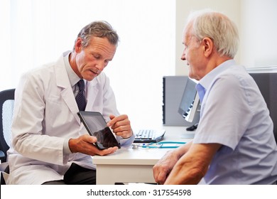 Senior Patient Having Consultation With Doctor In Office