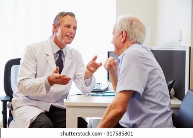 Senior Patient Having Consultation With Doctor In Office